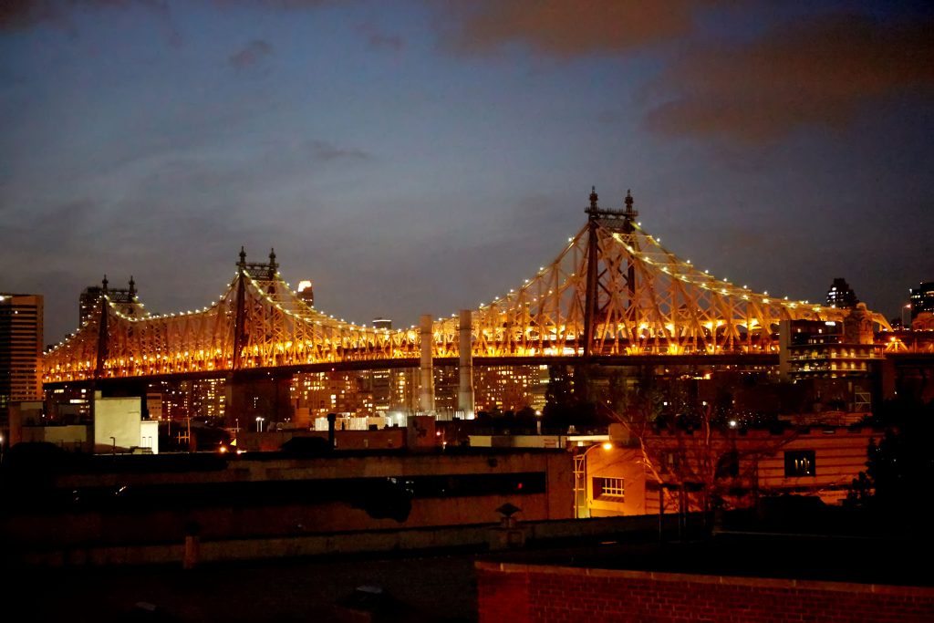 nighttime view of the Queensborough Bridge from The Local NY hostel